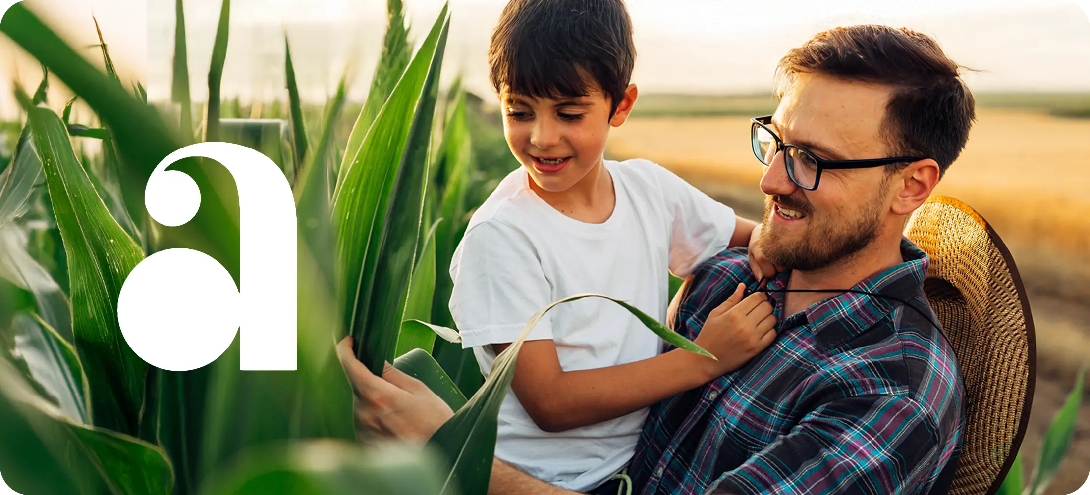 Image of dad and child watching the crops