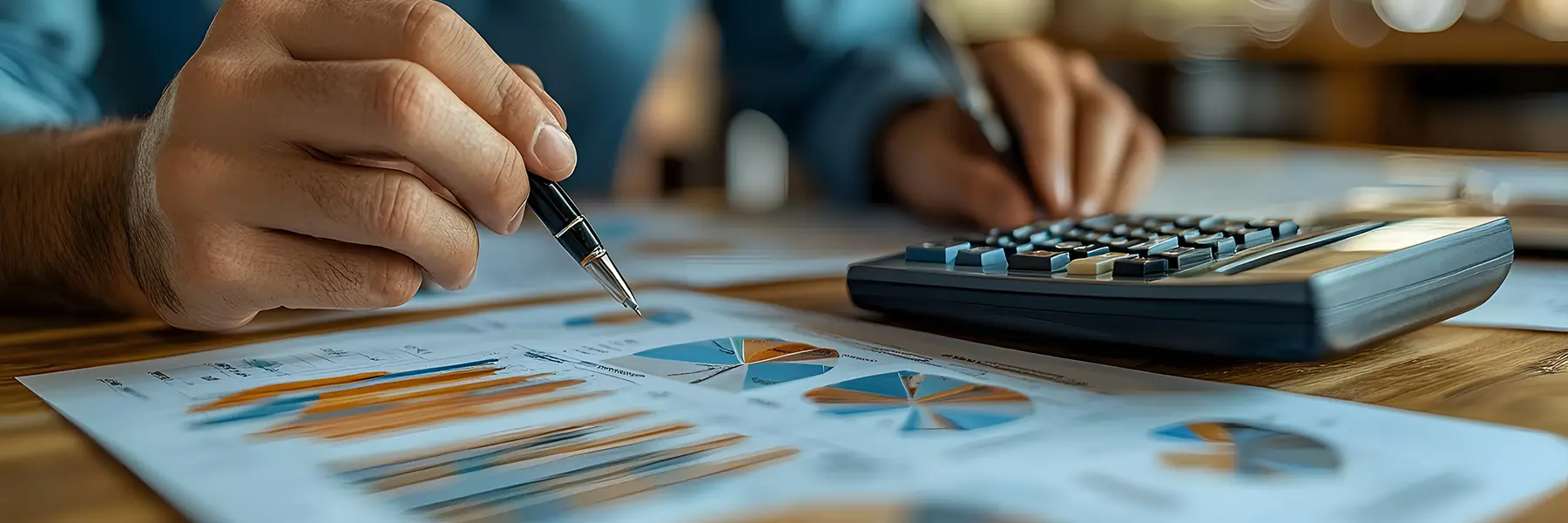 person analyzing statistics with a calculator on the side